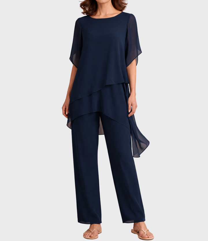 Navy two-piece set with flowing tunic and pants on model, front view in studio setting.