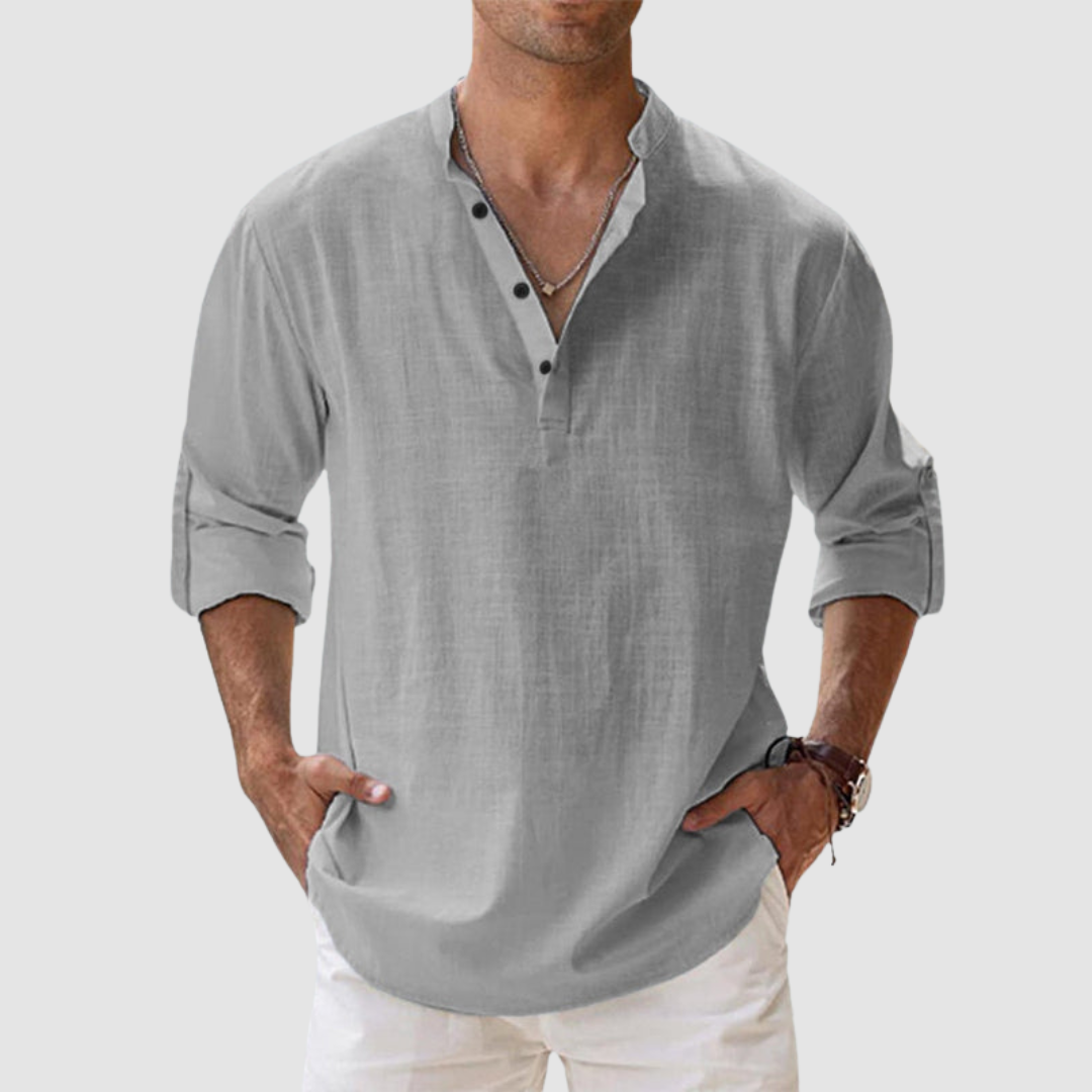 Grey long-sleeve breathable shirt with banded collar, button placket, white pants in studio.