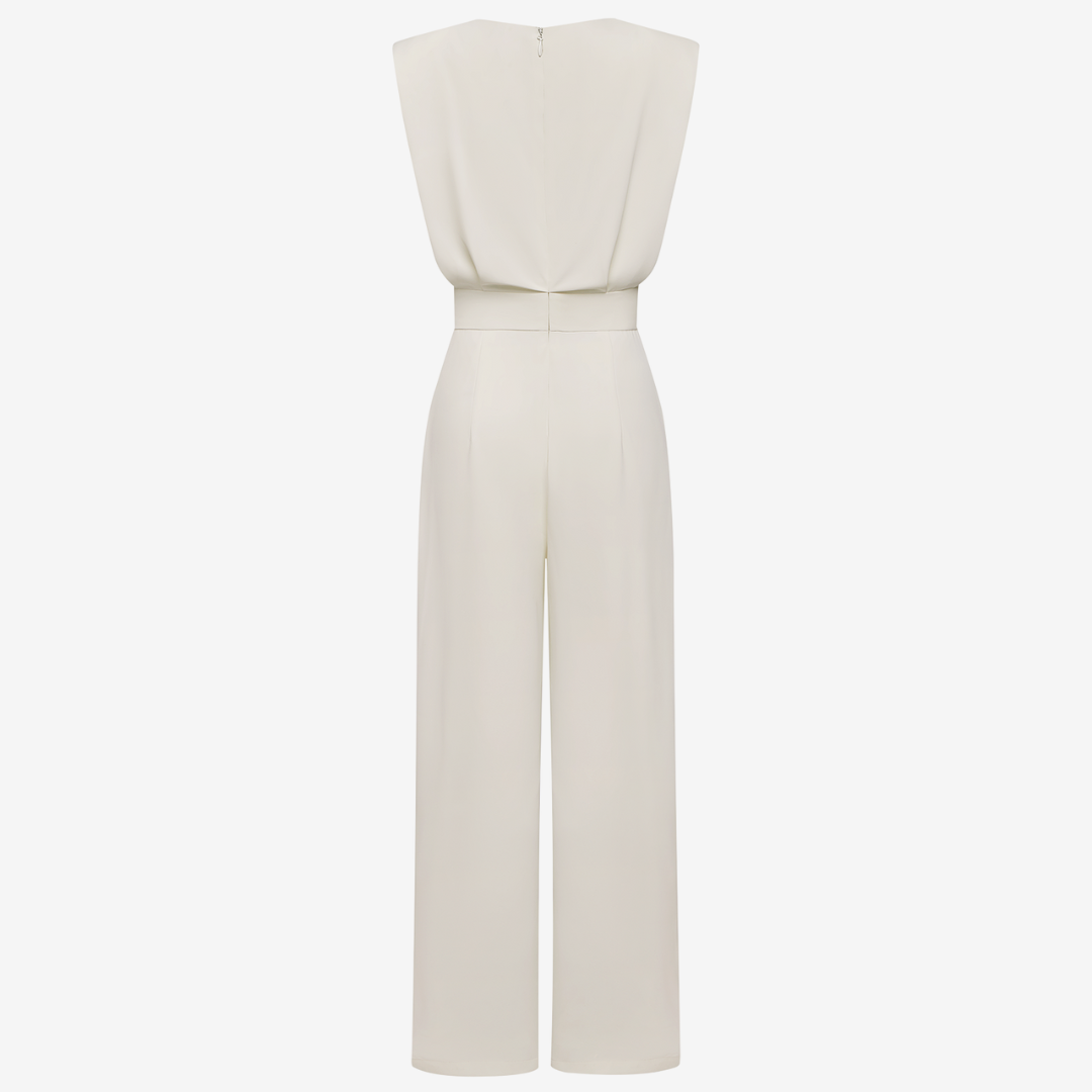 Back view of cream sleeveless jumpsuit with wide legs in studio setting.