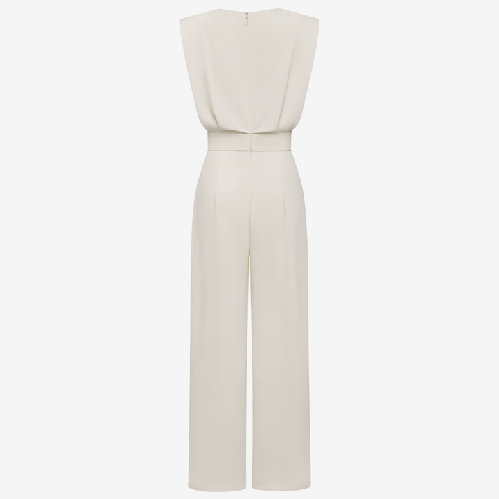 Back view of cream sleeveless jumpsuit with wide legs in studio setting.