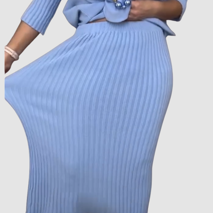 Detail of light blue ribbed skirt from 2-piece set, showcasing stretch and fit on plain background.
