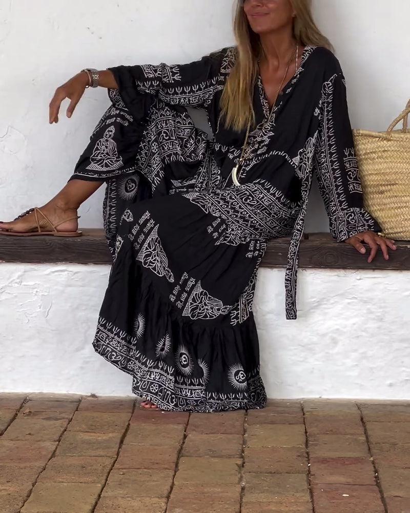 Emy – Printed Maxi Dress with V-Neck &amp; Bell Sleeves