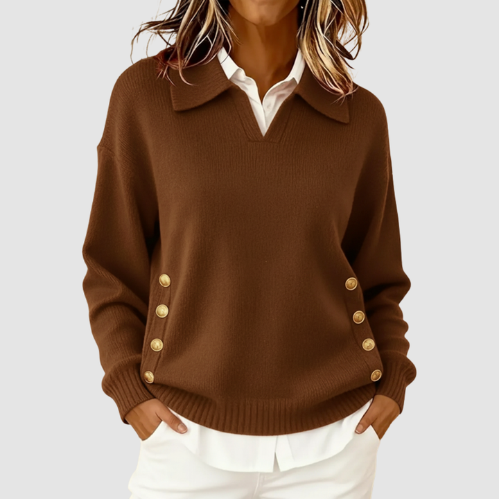 Elegant dark brown knitted sweater with gold buttons on sides, worn over a white shirt against a light grey background.