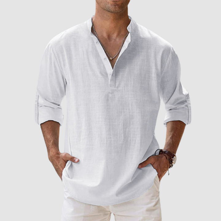 White long-sleeve breathable shirt with banded collar, button placket, white pants in studio.