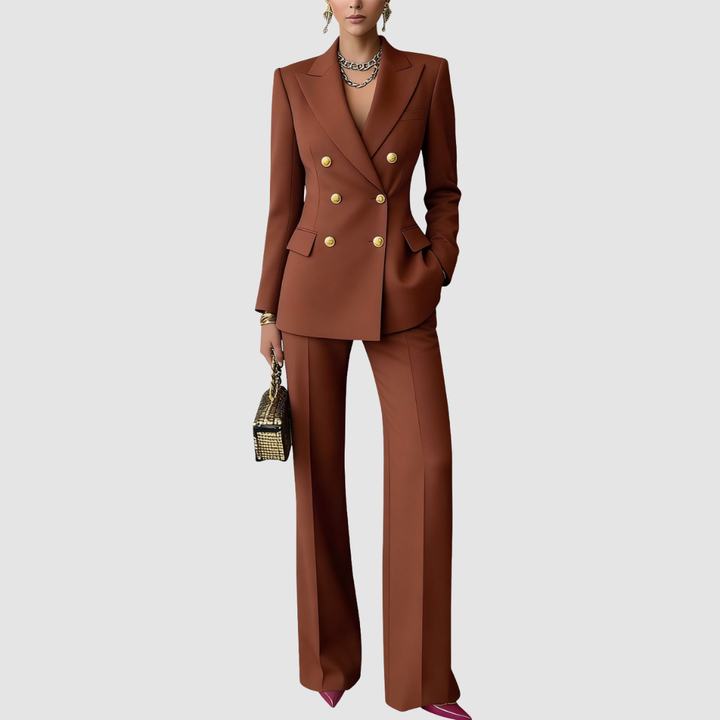 Chic brown tailored set with gold buttons, structured blazer, wide-leg pants, styled with jewelry and metallic handbag on a gray background.