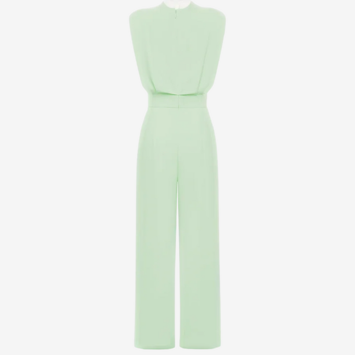 Back view of light green sleeveless jumpsuit with wide legs in studio setting.