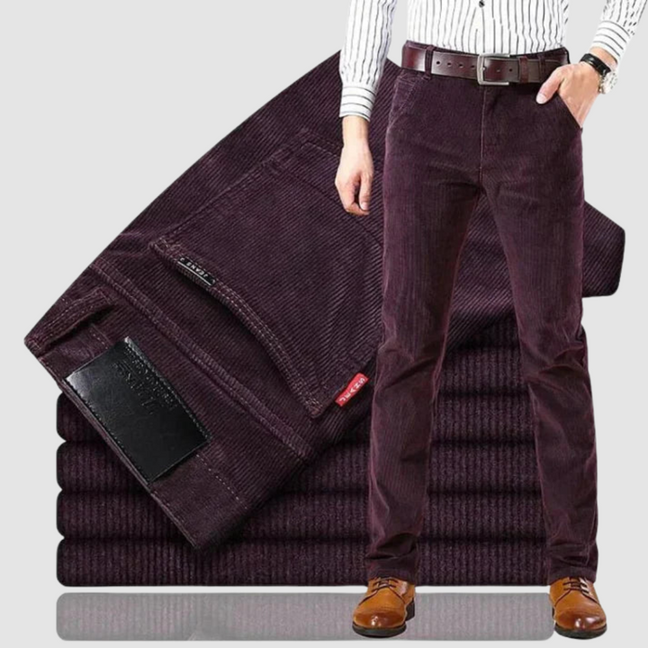 Deep burgundy corduroy trousers displayed against a neutral background, showcasing a sophisticated look.