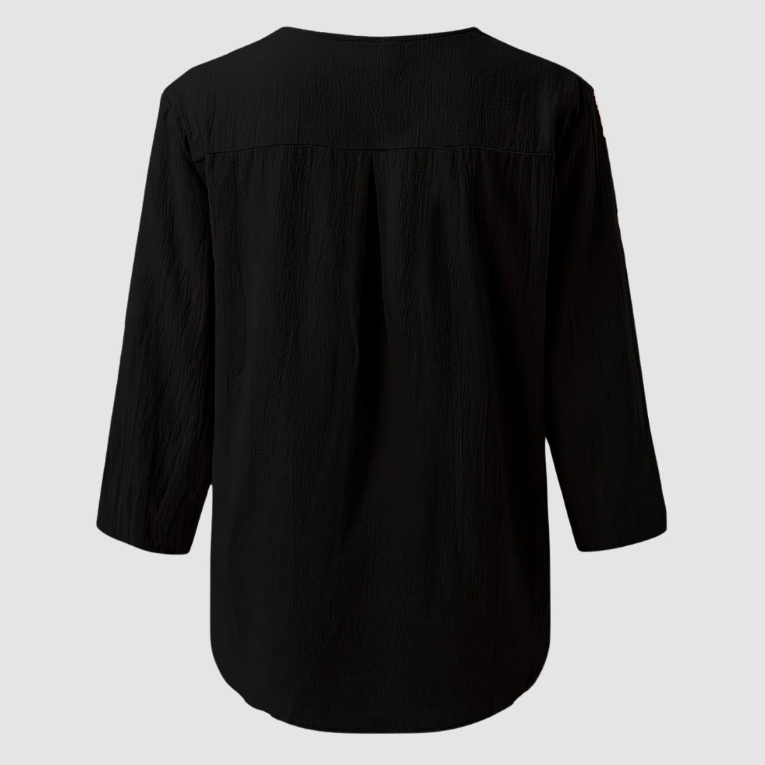 Back view of a black casual blouse displayed flat against a plain background.