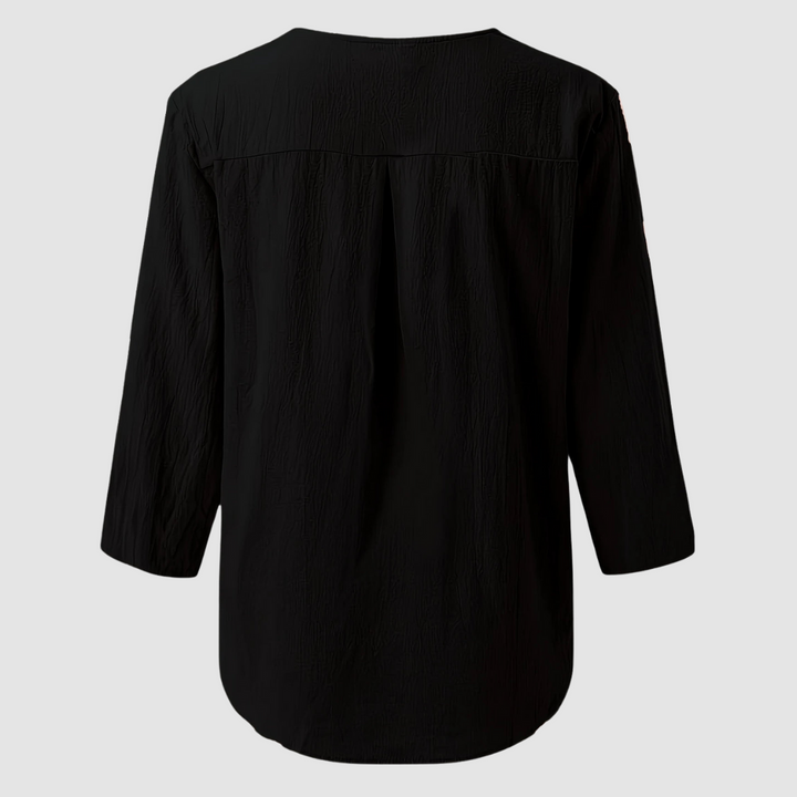 Back view of a black casual blouse displayed flat against a plain background.