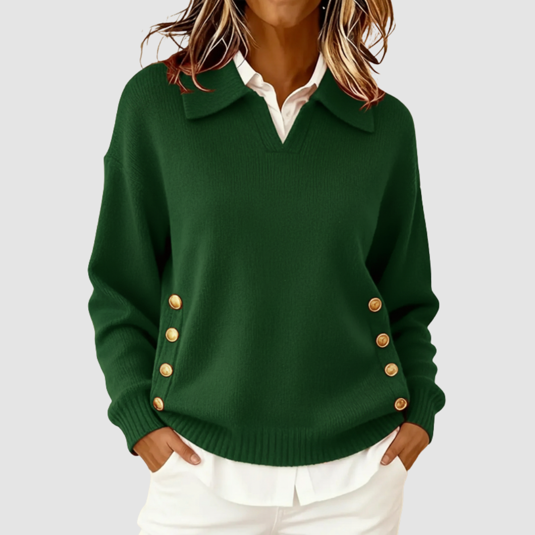 Elegant green knitted sweater with gold buttons on sides, worn over a white shirt against a light grey background.