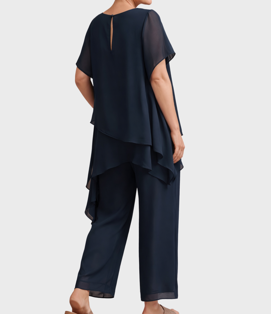 Navy two-piece set featuring layered tunic, model back view in studio setting.