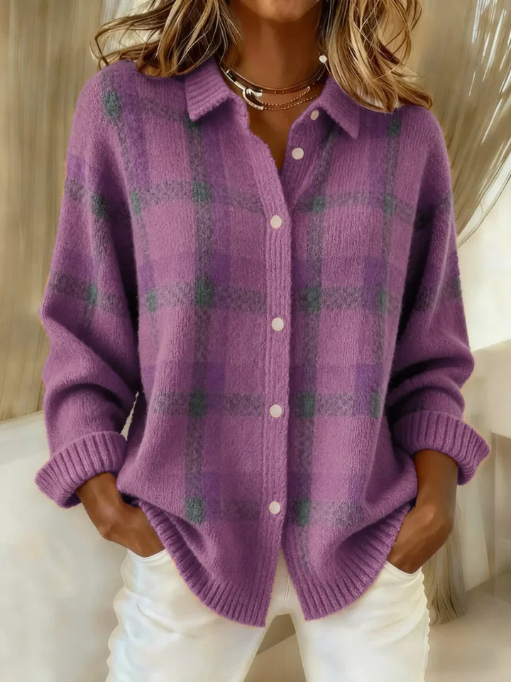 Purple plaid button-up top with a soft look, hands in pockets, showcased in an indoor environment.