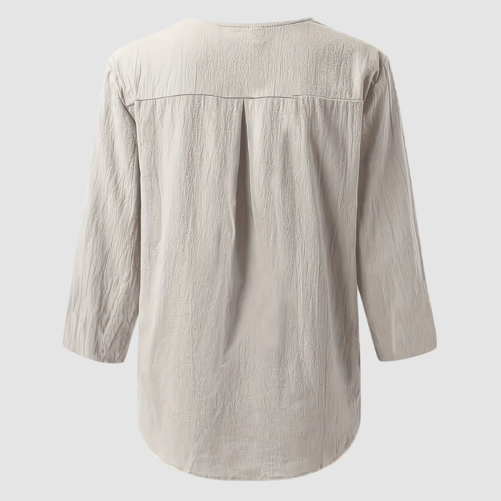 Back view of a beige casual blouse displayed flat against a plain background.