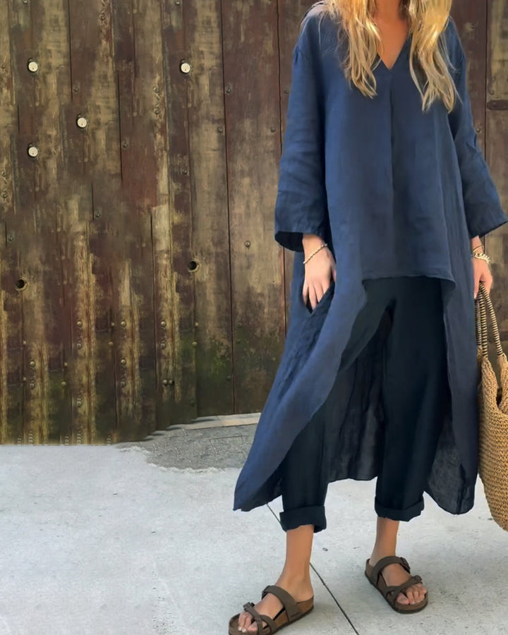 Navy chic set paired with a woven bag and sandals, rustic wall backdrop.