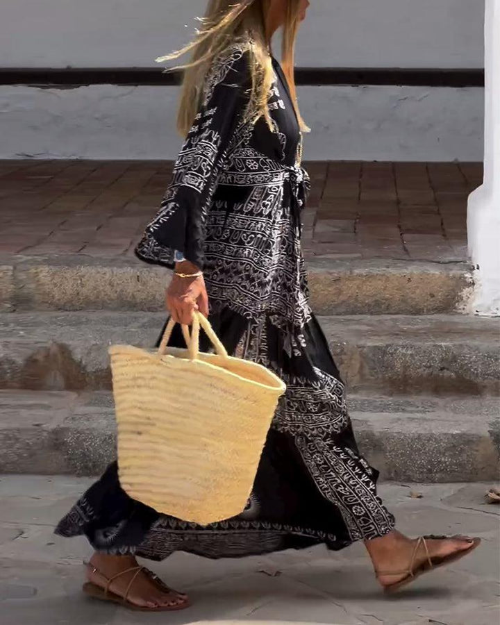 Emy – Printed Maxi Dress with V-Neck &amp; Bell Sleeves
