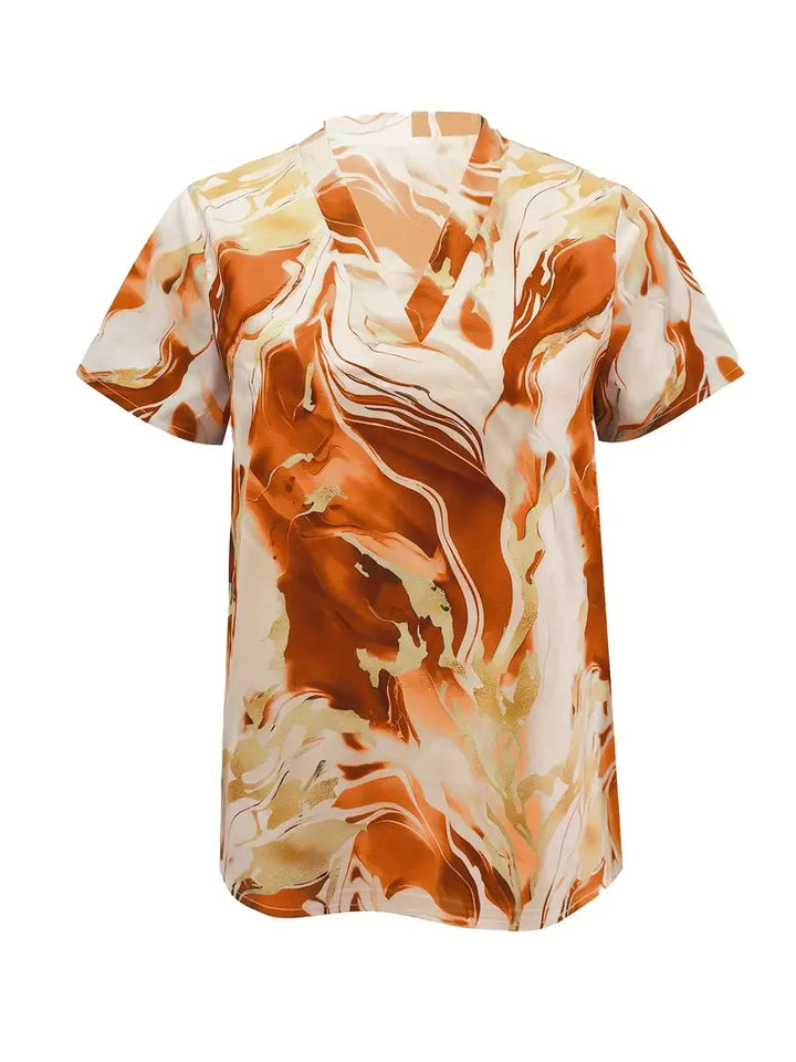 Orange marble print short sleeve shirt with v-neck on a white studio background.