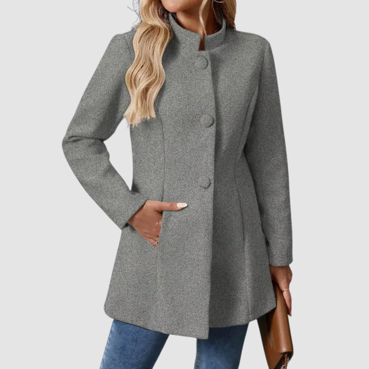 Gray jacket with large buttons, model torso view, hand in pocket, against plain background.