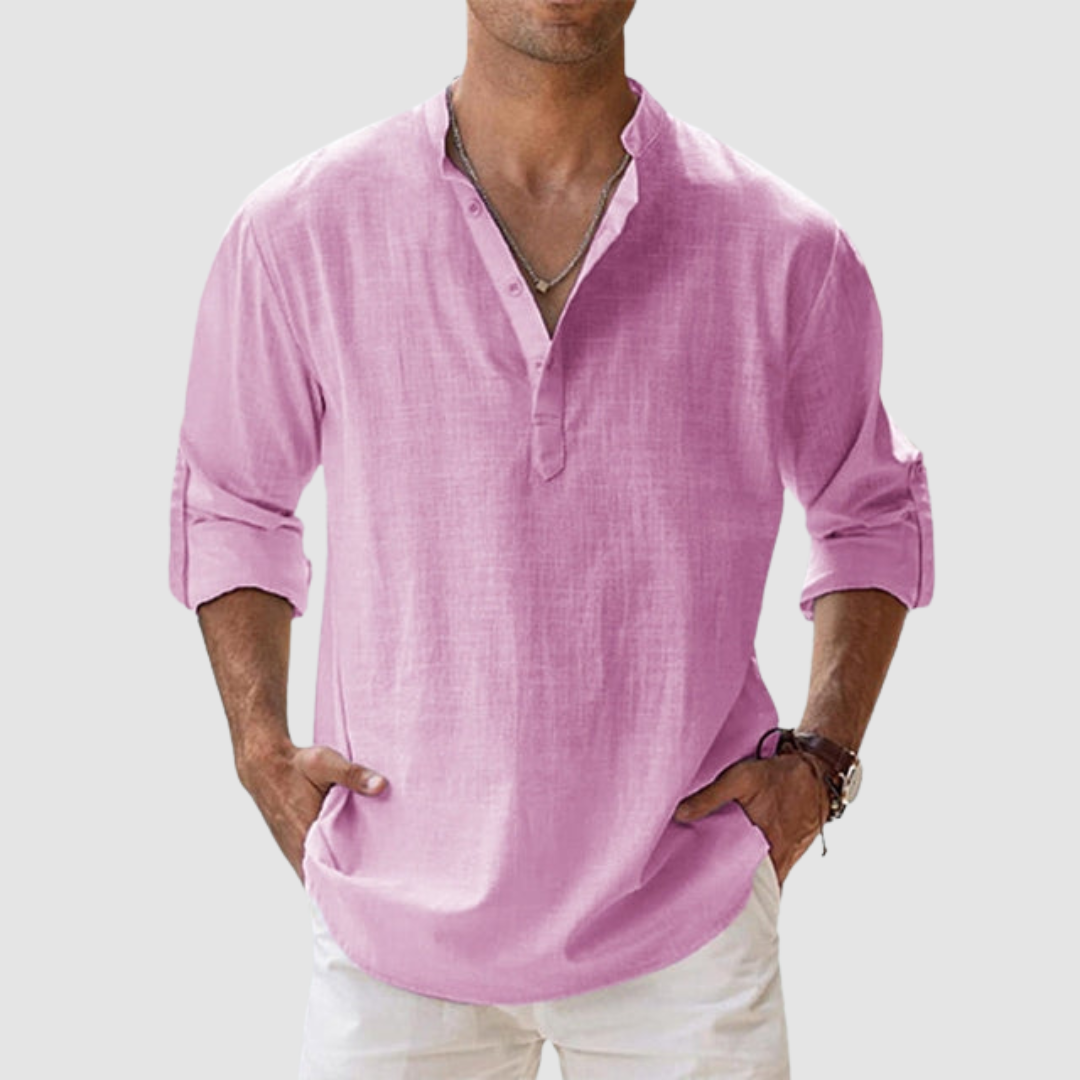 Pink long-sleeve breathable shirt with banded collar, button placket, white pants in studio.