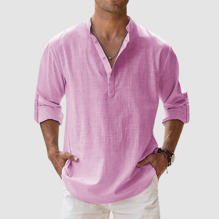 Pink long-sleeve breathable shirt with banded collar, button placket, white pants in studio.