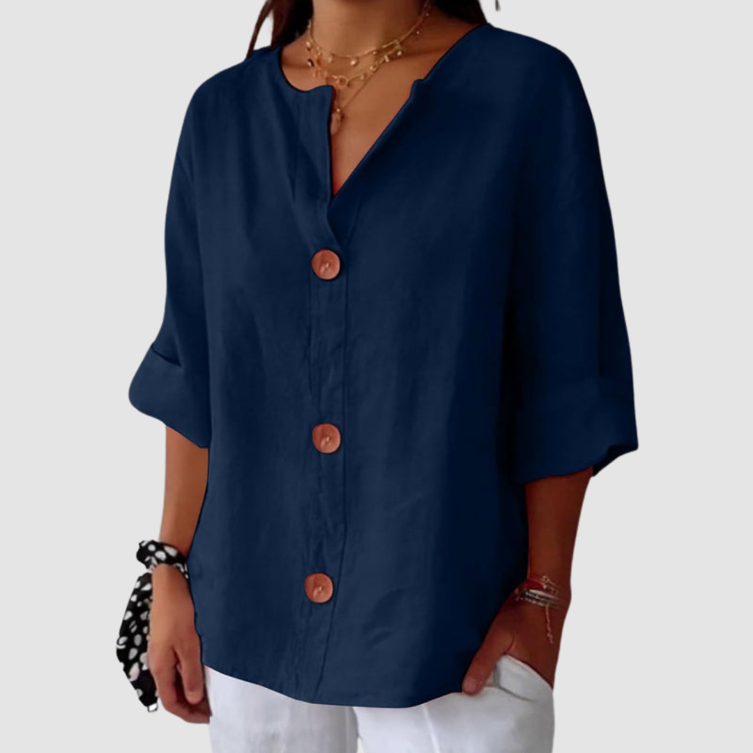 Navy blue casual blouse with wooden buttons, half sleeves, set against a plain background.