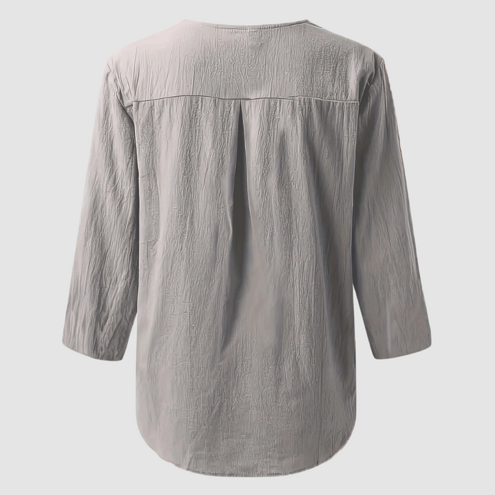 Back view of a grey casual blouse displayed flat against a plain background.