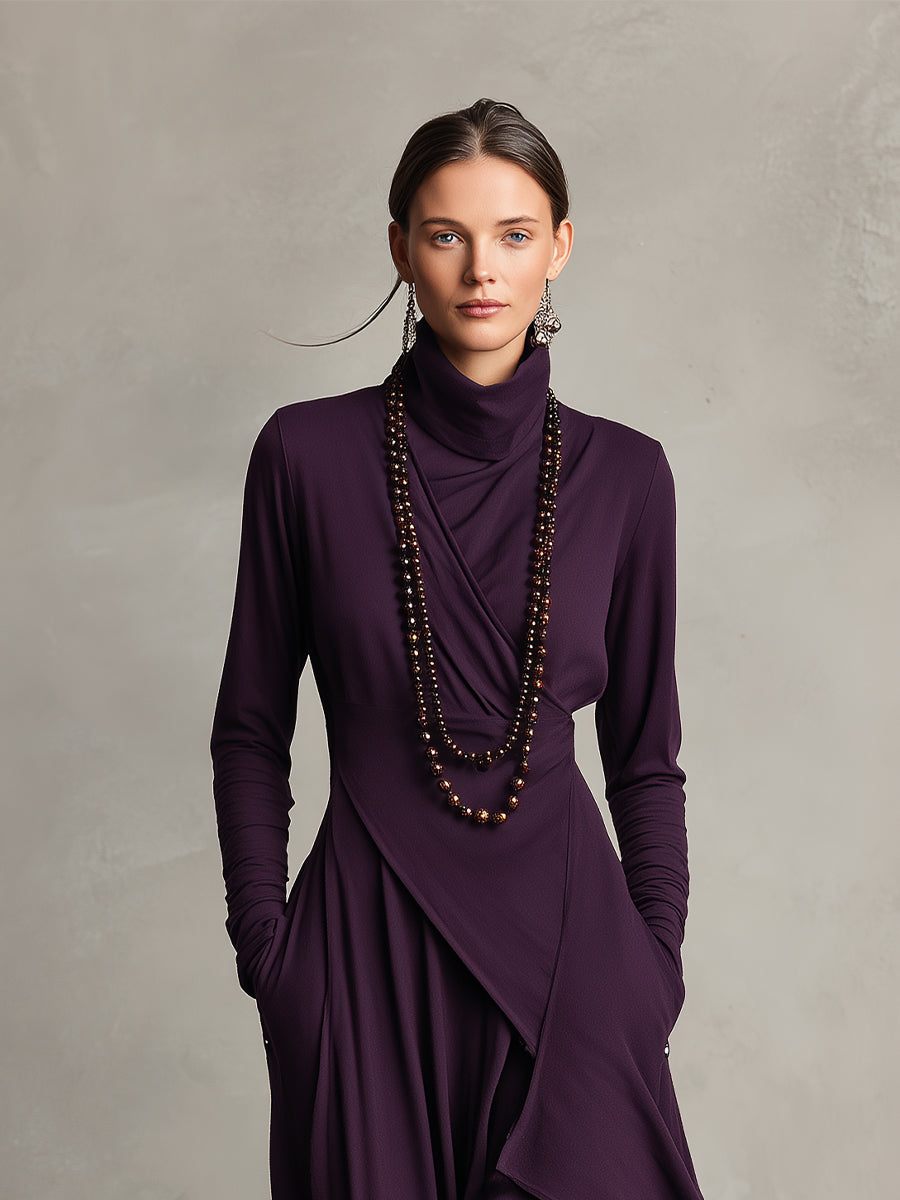 Close-up of a purple stretch maxi dress with draped neckline and layered design, in a studio setting.
