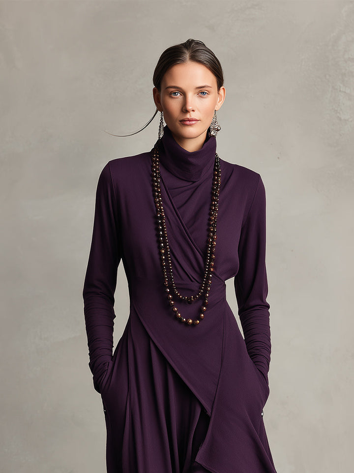 Close-up of a purple stretch maxi dress with draped neckline and layered design, in a studio setting.