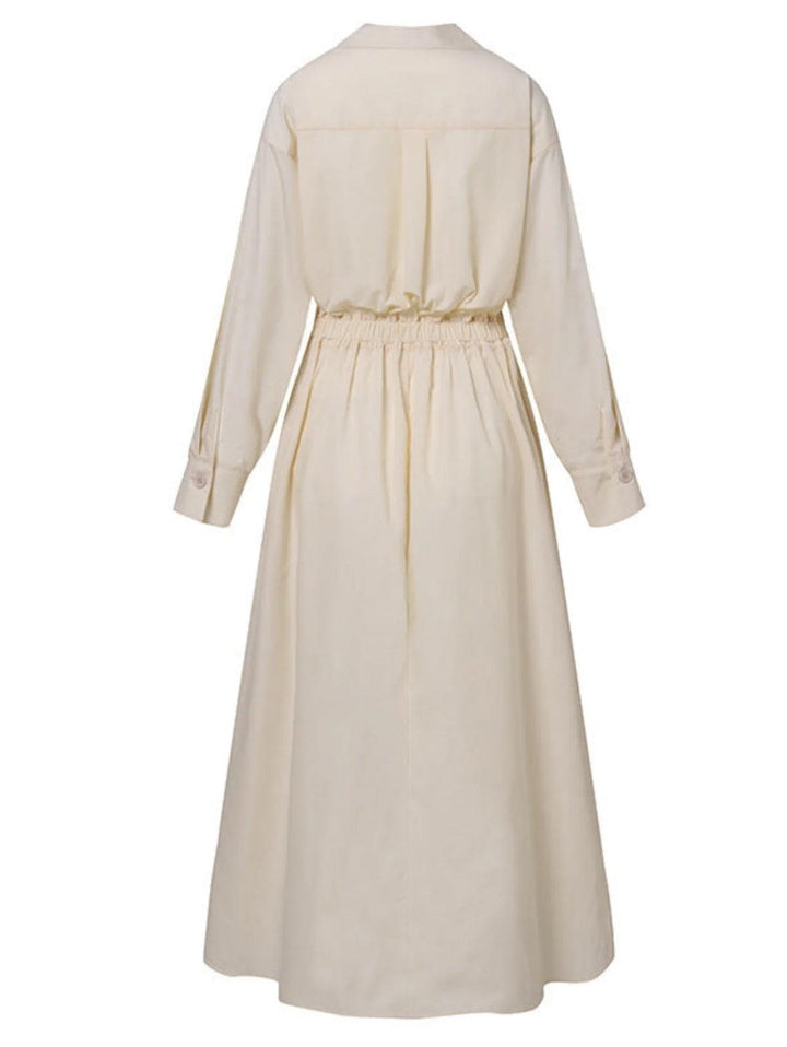 Back view of cream midi dress with button lapel and elastic waist, shown in a studio setting.