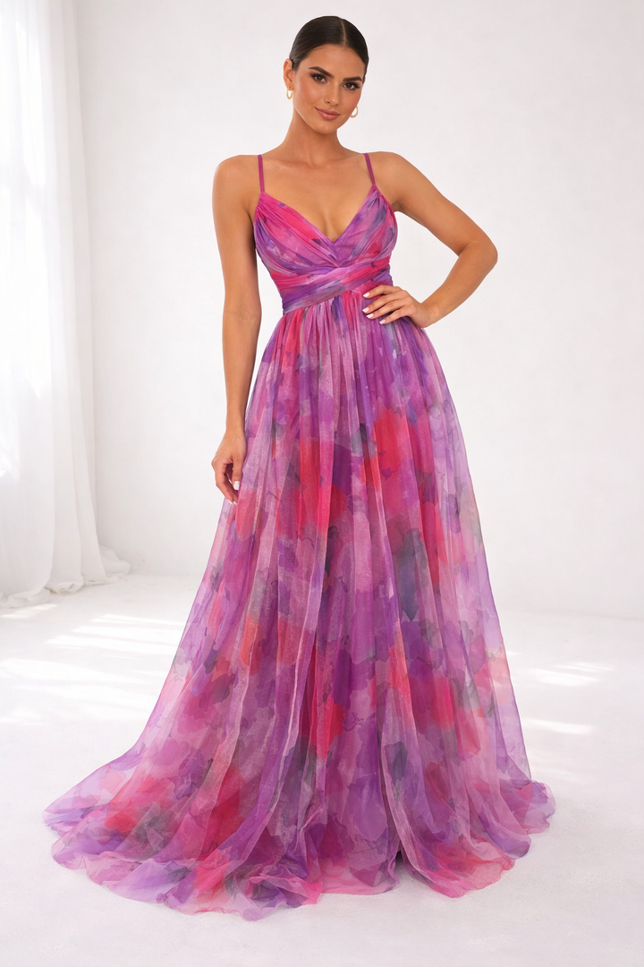 Elegant dress in purple and red tones, thin straps, studio background, soft natural lighting.