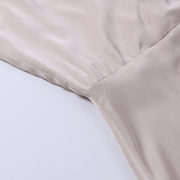 Detailed view of the light beige dress&