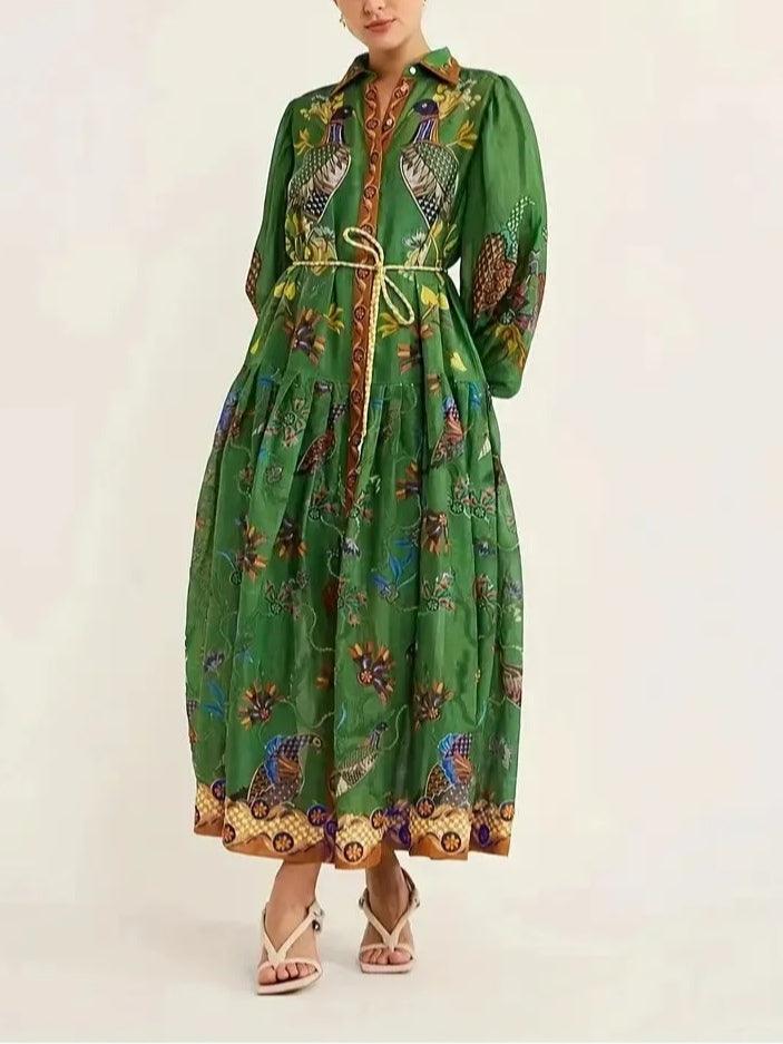Green floral maxi dress with puff sleeves and detailed print, front view in studio.