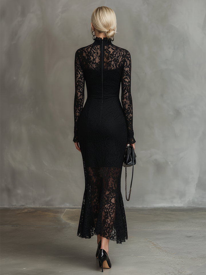 Rear view of a black lace maxi dress with long sleeves, worn in a studio setting.