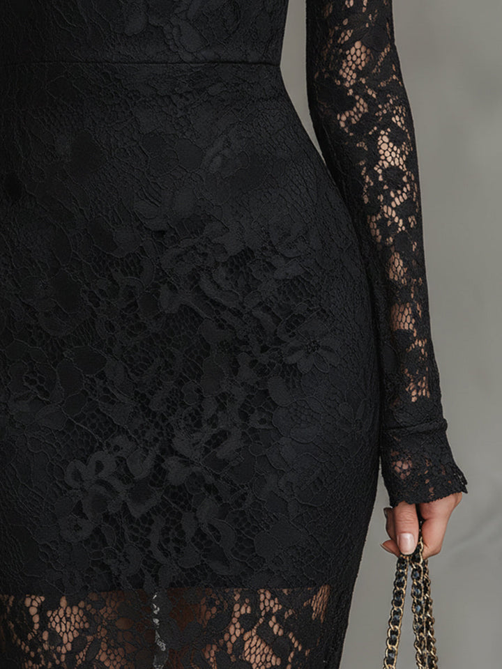 Close-up of black lace detailing on a maxi dress, featuring long sleeves in a studio setting.