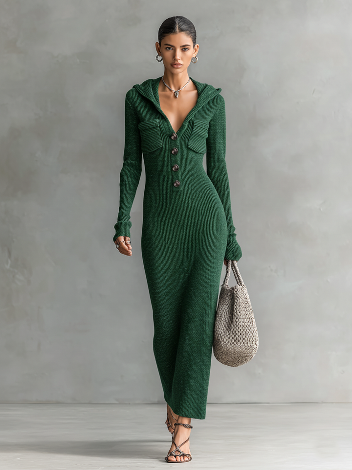 Model wearing a green slim-fit hooded maxi dress with button detail and a woven bag against a neutral background.