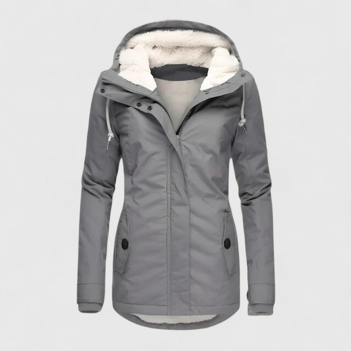 Gray winter coat with hood, plush interior lining, and button details in a studio environment.