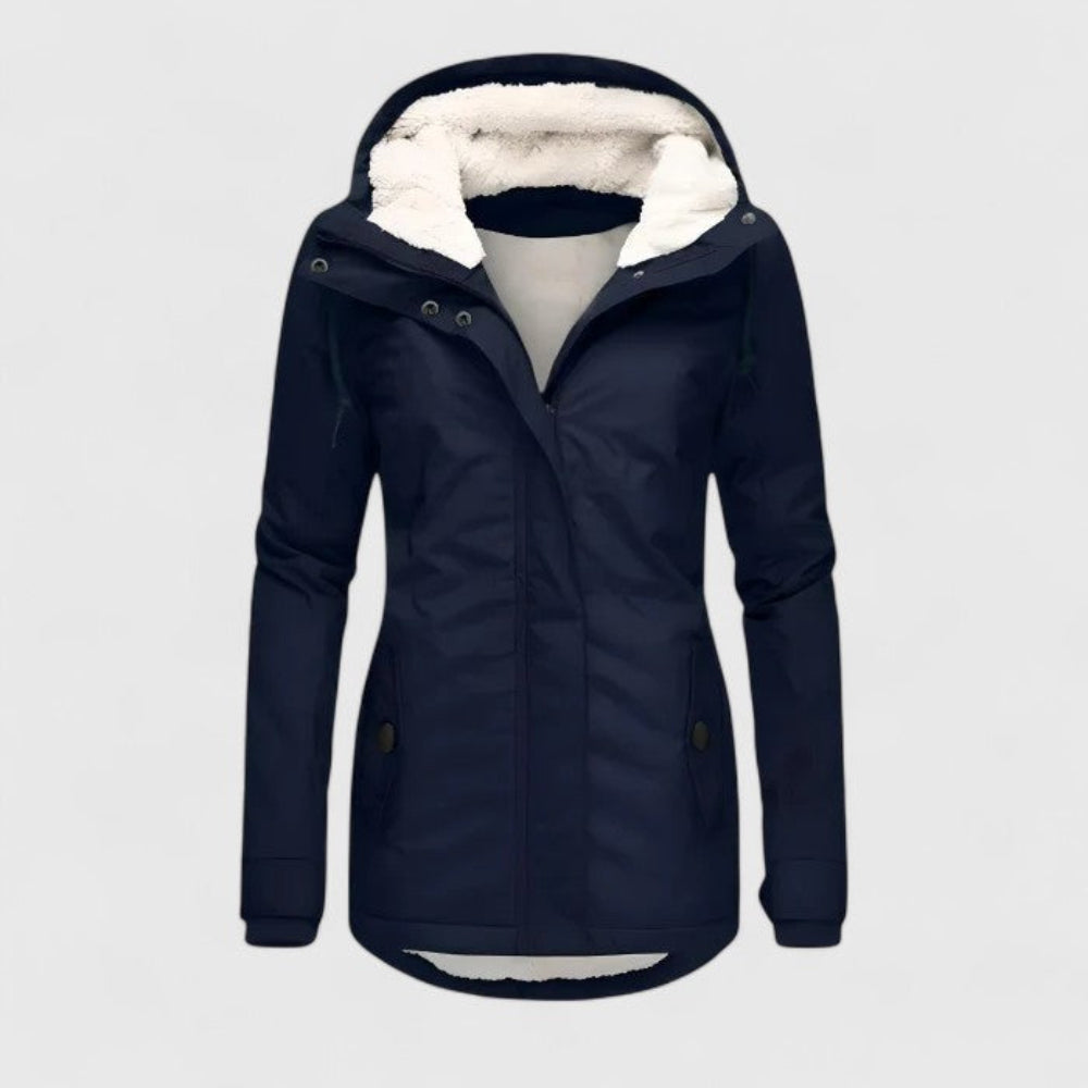 Navy winter coat with hood, plush interior lining, and button details in a studio environment.