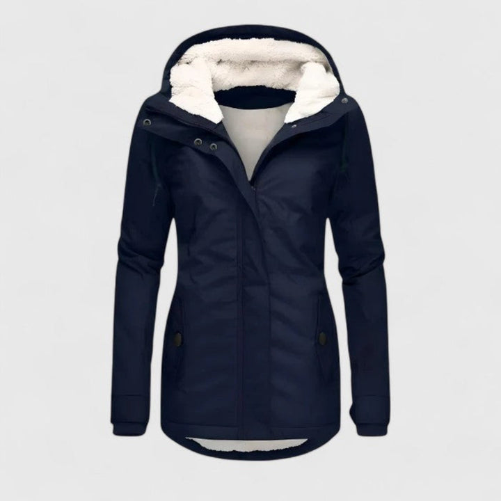 Navy winter coat with hood, plush interior lining, and button details in a studio environment.