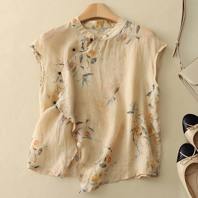 Beige floral sleeveless top on a hanger, with soft texture, set against a light background with shoes and a bag.