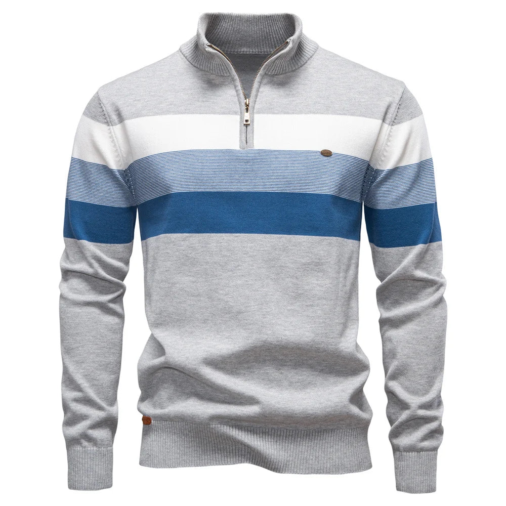 Gray and blue striped pullover displayed on a plain white studio background.
