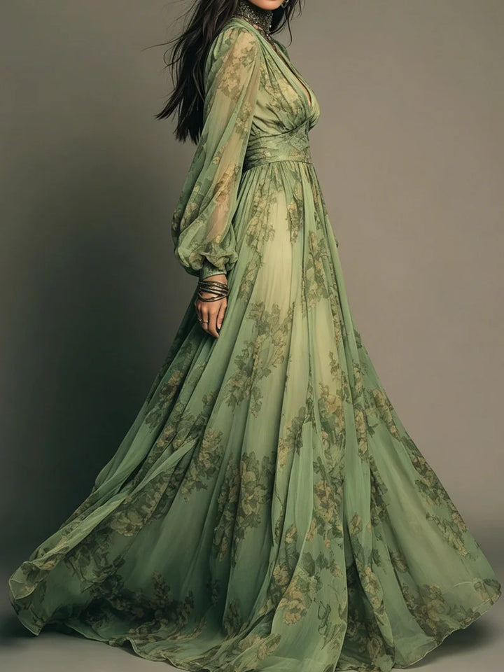Elegant green maxi dress with floral details and sheer sleeves, displayed in a studio from a side view.