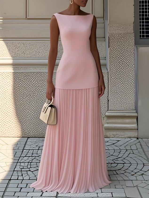 Chic pink pleated maxi dress with a sleek top, accessorized with a beige handbag in an urban environment.