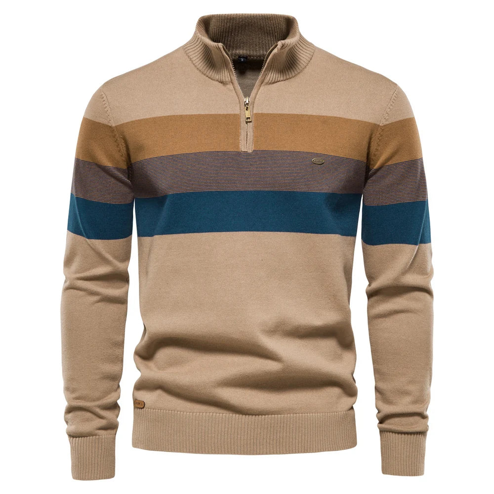Beige, blue, and tan striped pullover on a plain white studio backdrop.