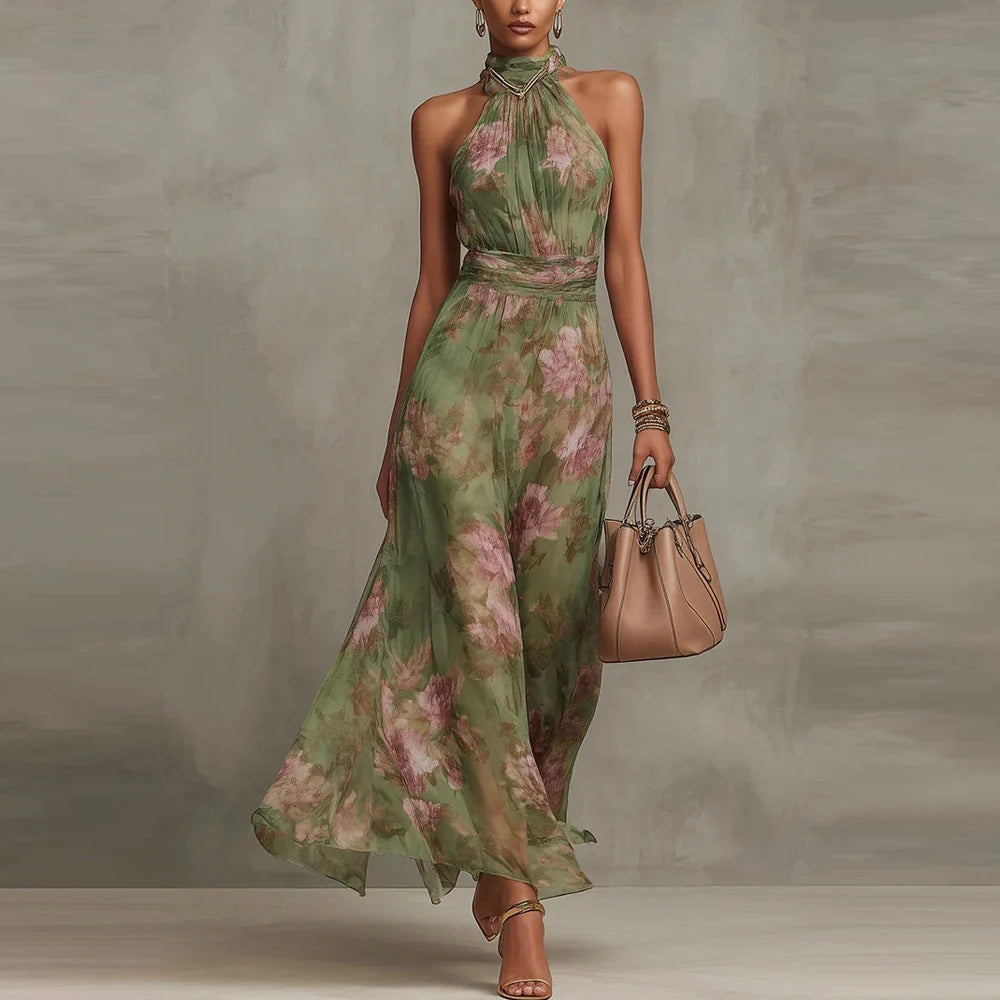 Green floral halter-neck maxi dress in studio setting with beige handbag.