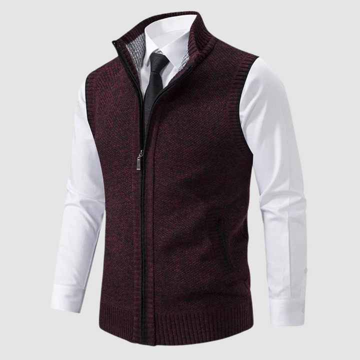 Dark red fleece gilet displayed over white shirt and black tie in studio.