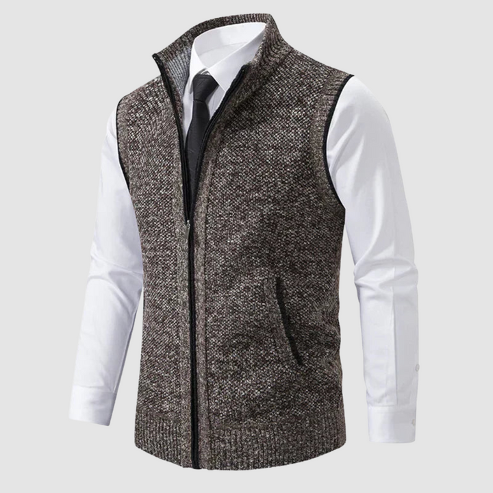 Brown fleece gilet showcased over white shirt and black tie in studio.