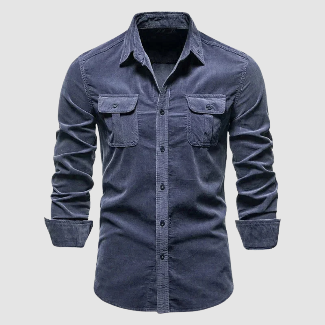Dark blue corduroy shirt with buttoned flap pockets and a soft texture, displayed against a simple light background.