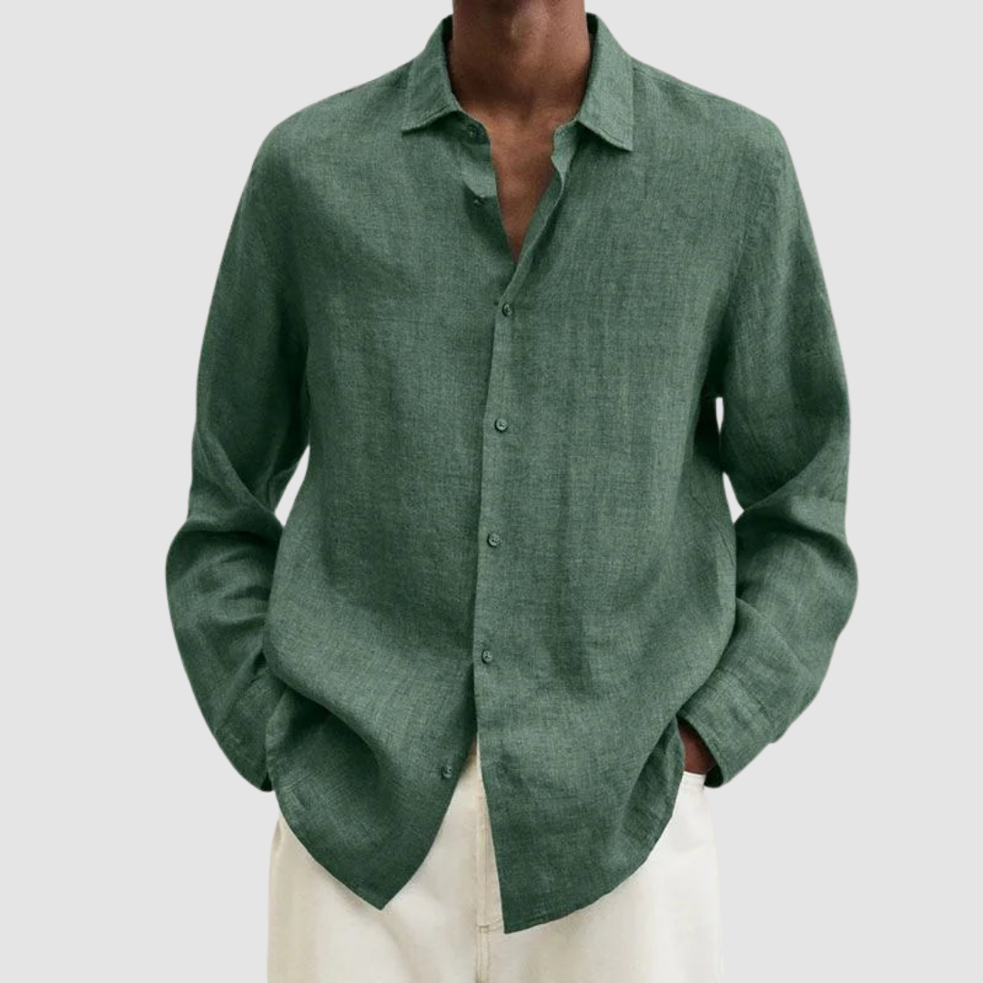 Model wearing a green lightweight shirt with hands in pockets, against a light gray background.