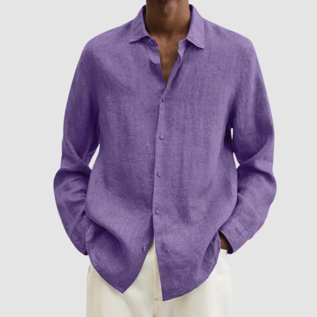Model wearing a purple lightweight shirt with hands in pockets, against a light gray background.
