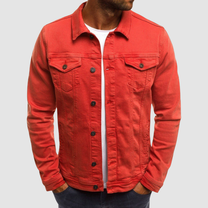 Model wearing a red jacket with button closure and chest pockets, paired with a white shirt, against a gray background.
