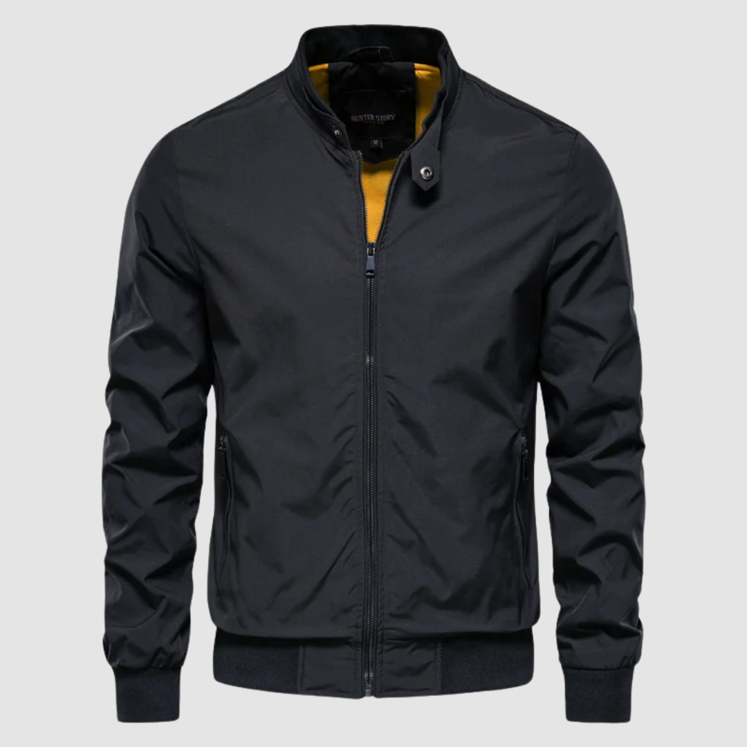 Front view of a dark navy lightweight bomber jacket with contrast interior on a grey background.